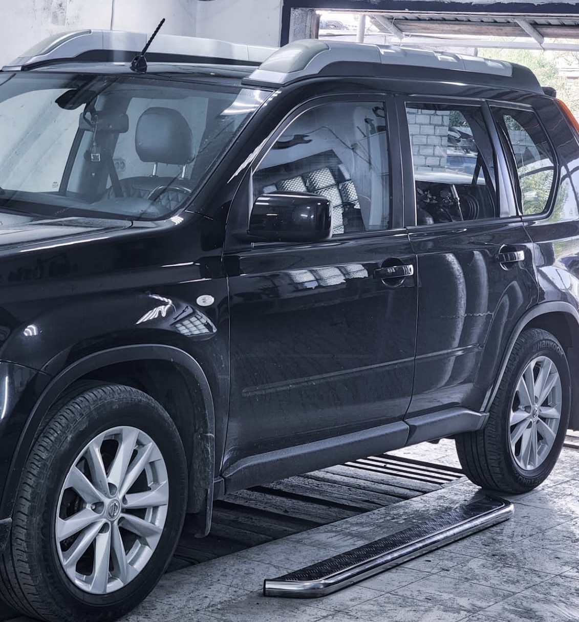 Happy customer with repaired vehicle